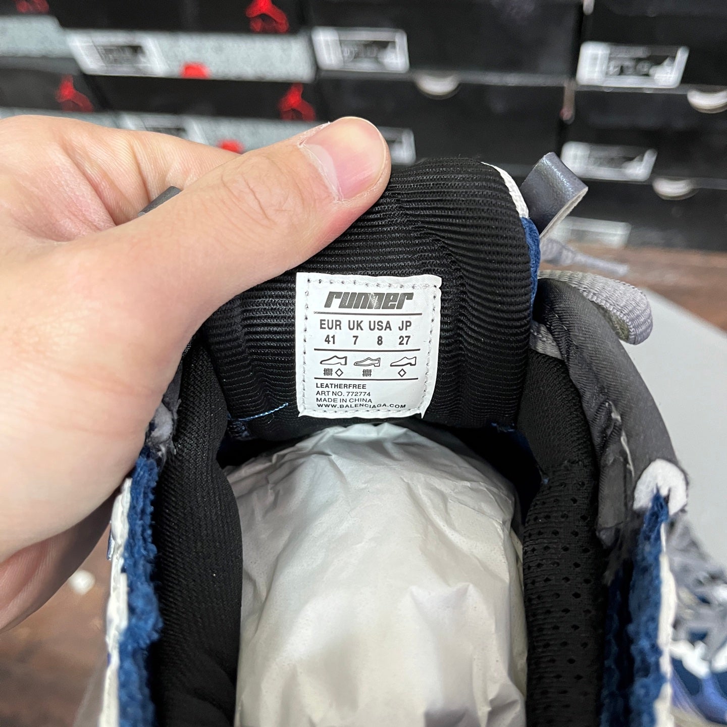 Black sneaker tongue label with EU/UK size and runner branding