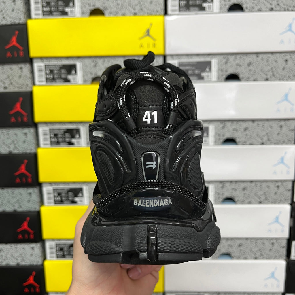 Balenciaga unisex black runner shoe back view with size area at heel