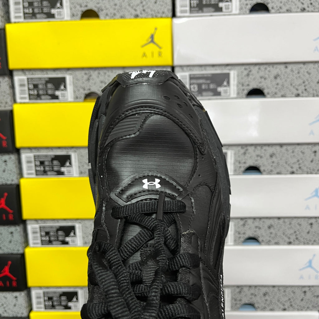 Balenciaga unisex black runner shoe front view with laces and mesh panels