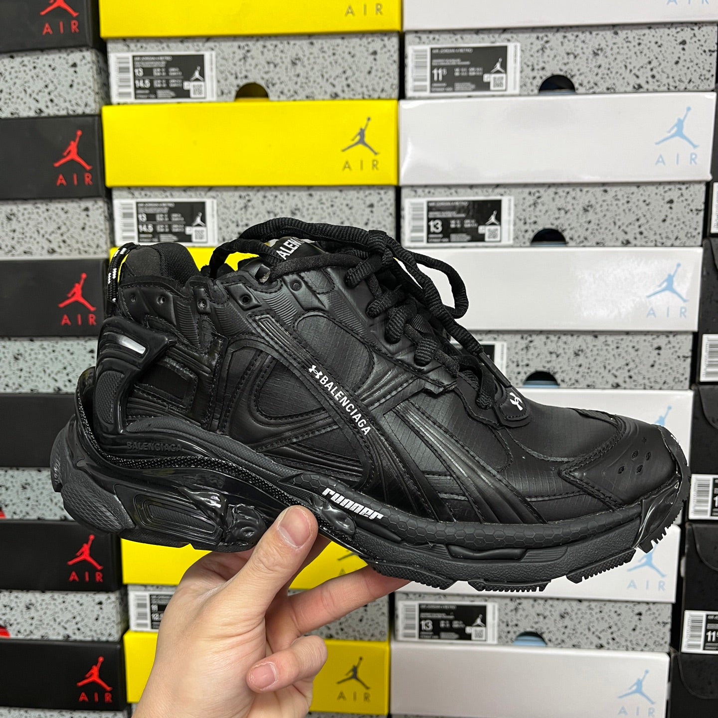 Balenciaga unisex black runner shoe with black laces and chunky sole