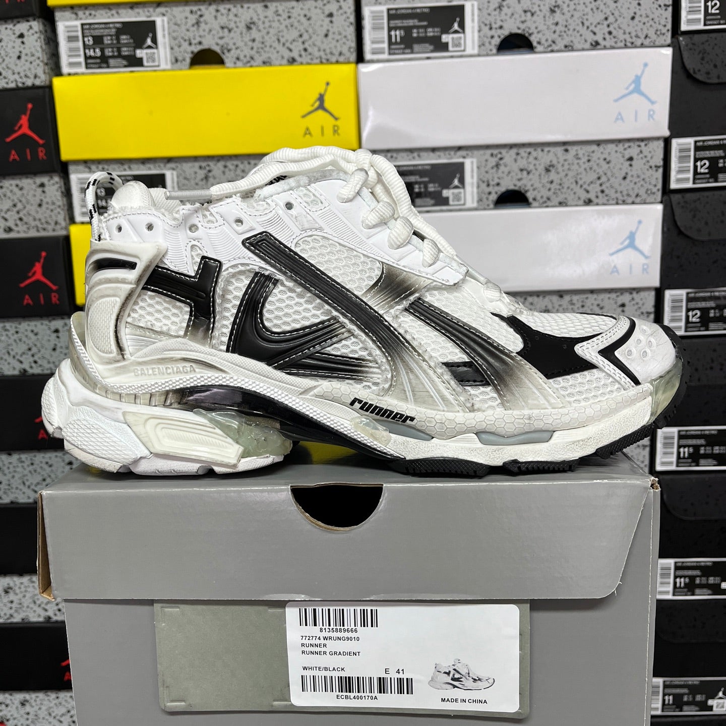 Balenciaga unisex lace-up sneaker, white upper with black panels and silver accents