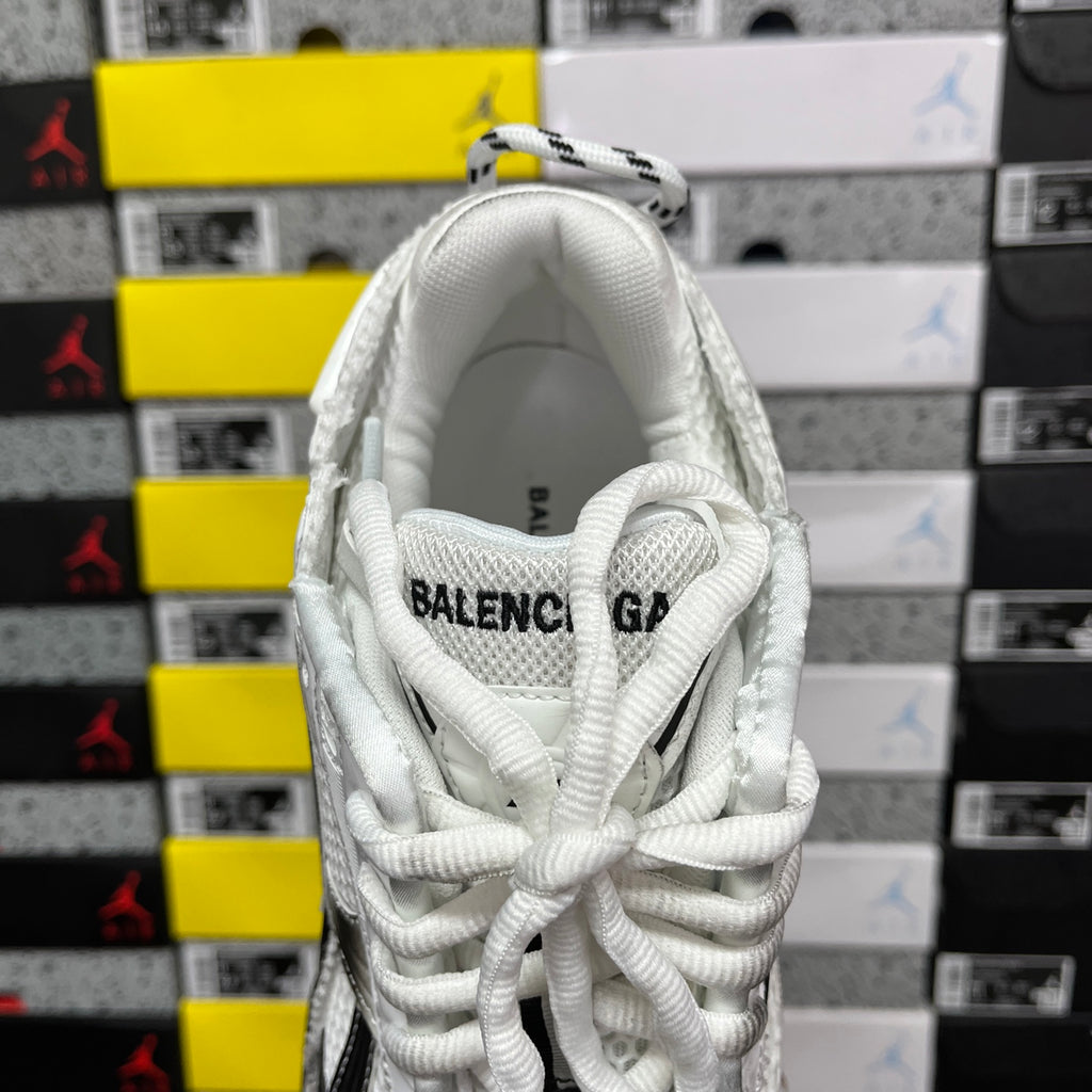 Balenciaga unisex sneaker tongue view, white laces and fabric with printed logo text