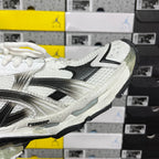 Balenciaga unisex sneaker side profile, white and black upper with silver reflective details