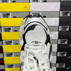 Balenciaga unisex sneaker heel view, white textured fabric with black trim and laces