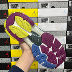 Balenciaga unisex running shoe outsole view, purple tread with blue accents and yellow interior