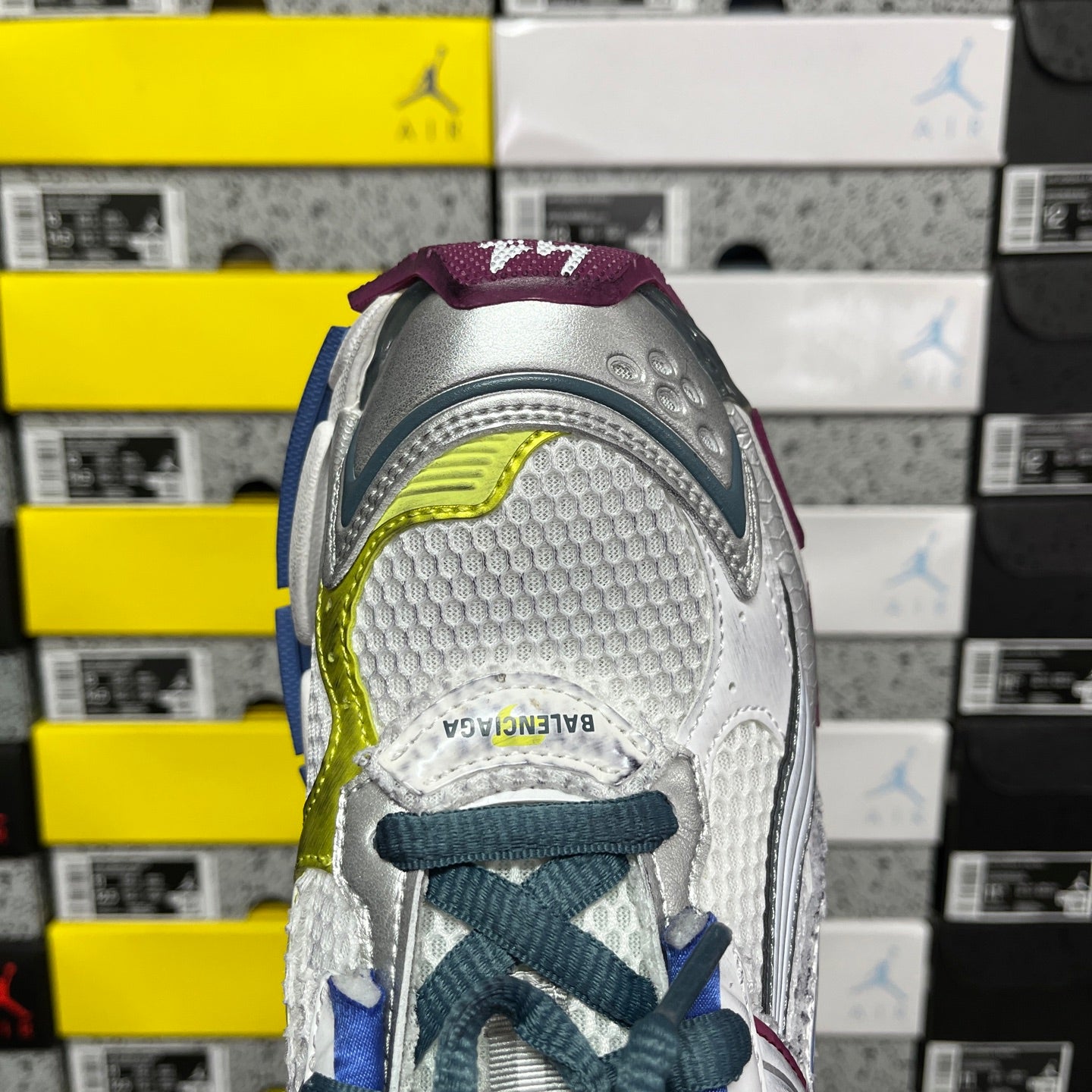 Balenciaga unisex running shoe heel view, white tread with blue and neon green side detail