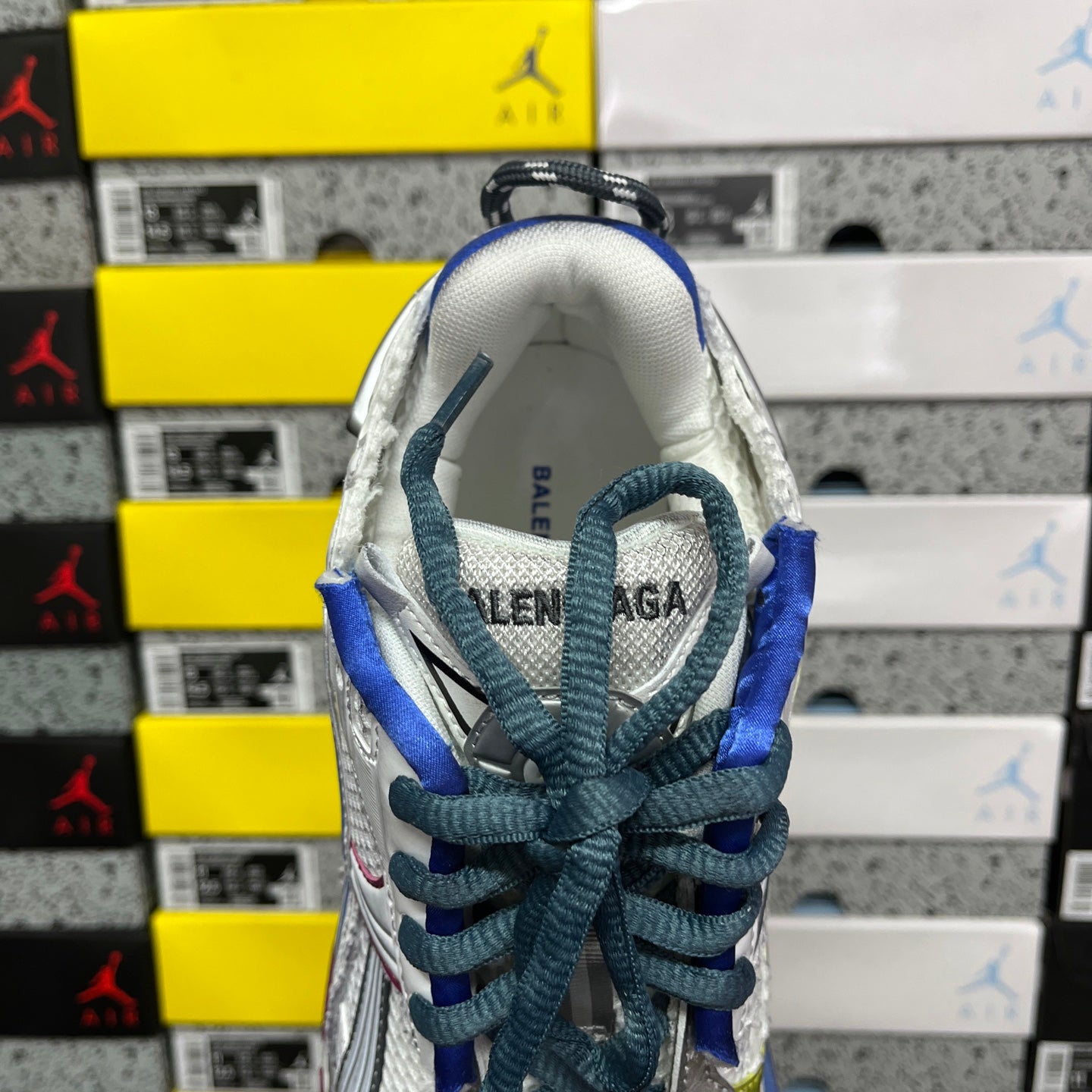 Balenciaga unisex running shoe tongue and lace area, white lining with blue laces