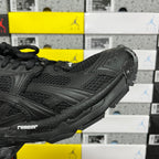 Balenciaga unisex black sneaker side close-up, molded overlays and thick sole