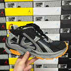 Balenciaga unisex sneaker, black and gray with orange trim and chunky sole