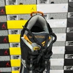 Balenciaga sneaker heel view with black knit upper, orange accents, Balenciaga text
