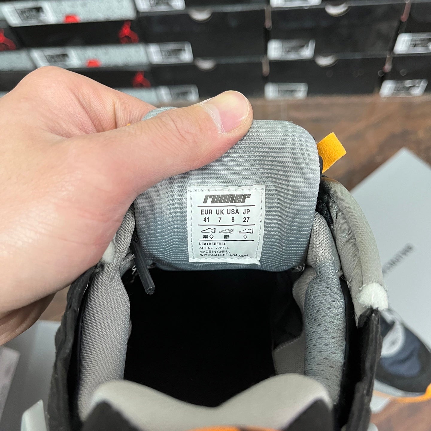 Balenciaga sneaker tongue label in black and gray with size markings and Fit tag