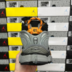 Balenciaga sneaker back view with orange heel tab and gray sole