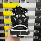 Runner sneaker back view, black heel with size patch and laces