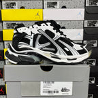 Runner sneaker, black and white with striped overlays and lace-up front
