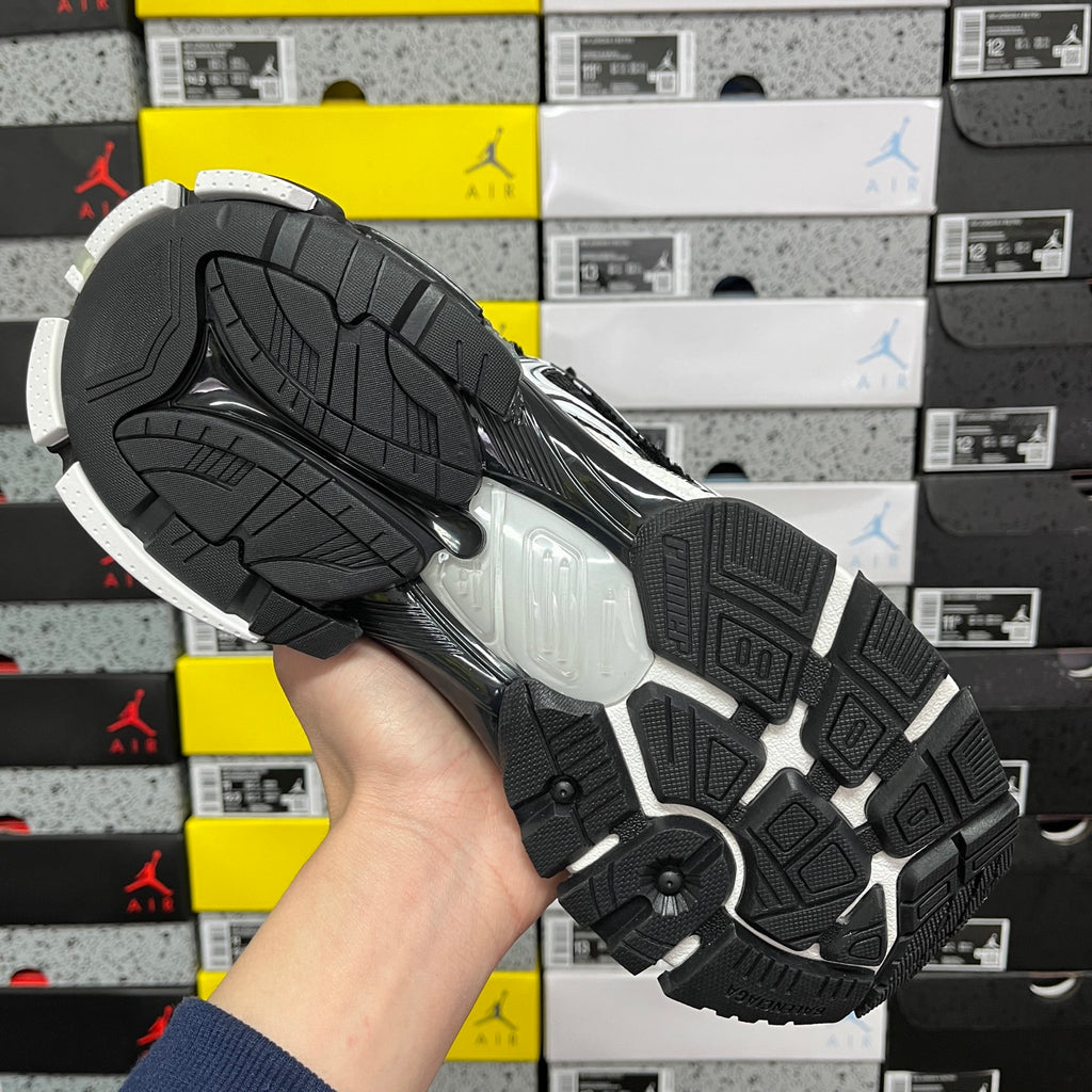 Runner sneaker outsole, black rubber tread with light midsole