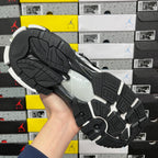 Runner sneaker outsole, black rubber tread with light midsole