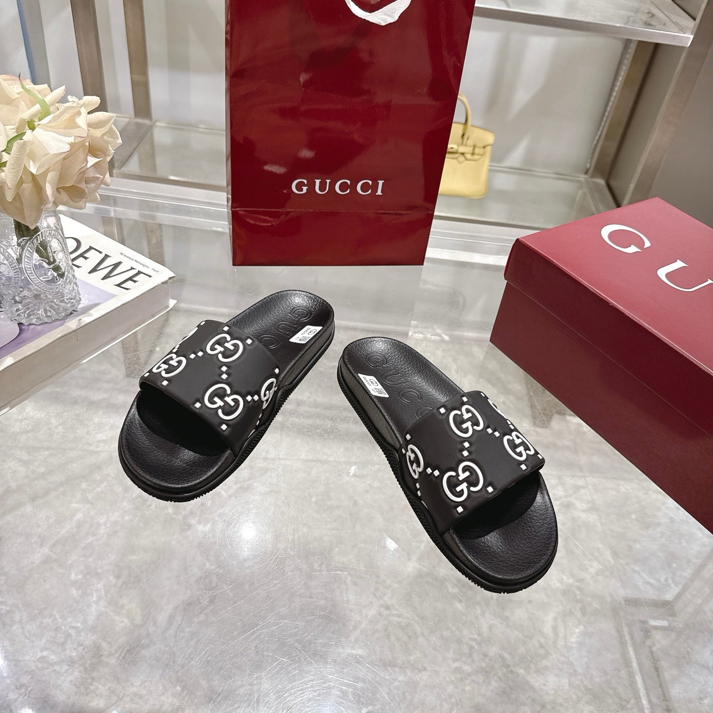 Gucci black slide sandals, GG logo print strap, contoured black rubber sole