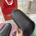 Gucci black slide sandal footbed with embossed GG logo and textured tread