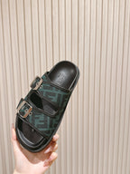 Fendi monogram slide sandals side profile, black leather and dark green patterned straps