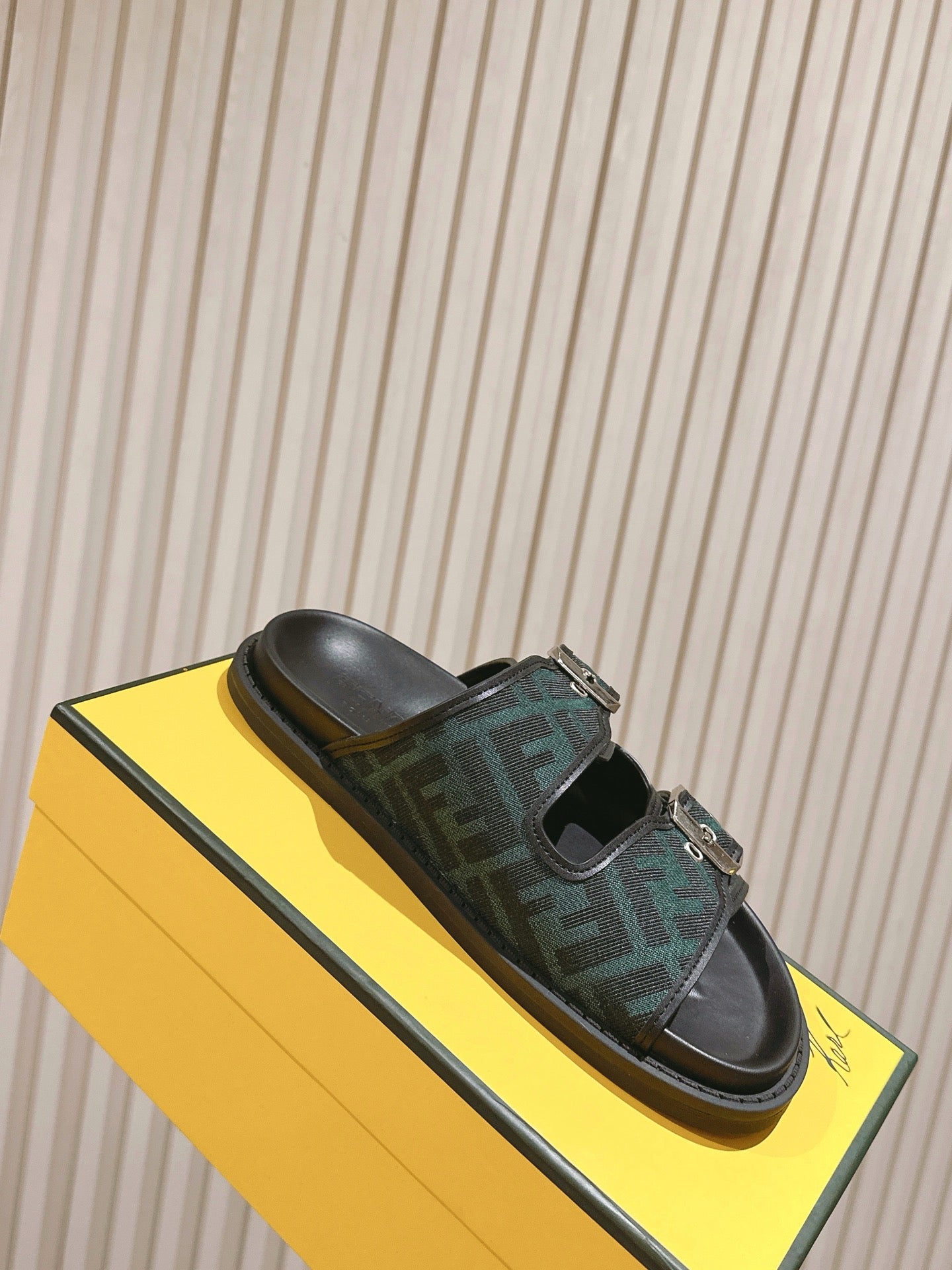 Fendi monogram sandals on yellow box, dark green FF straps with silver buckles