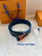 Louis Vuitton belt on white pouch, dark blue strap with orange buckle