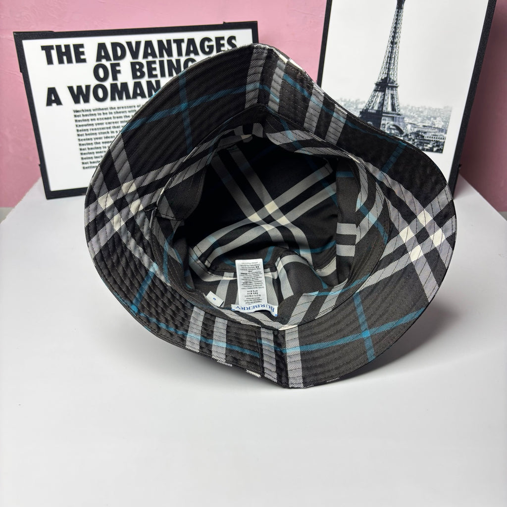 Plaid bucket hat interior view with fabric label and stitched brim; black and blue checks
