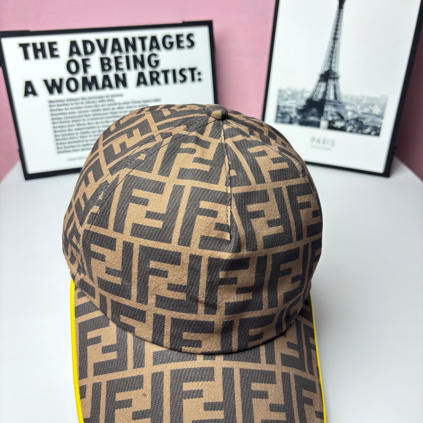 FF-logo cap in brown monogram print, top seam and small button detail