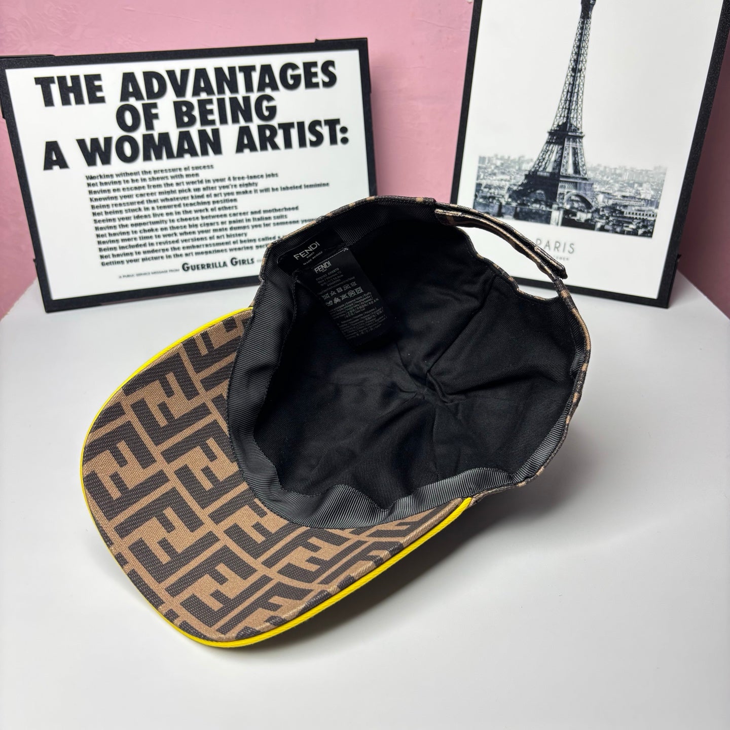 FF-logo cap interior showing black lining and crown seam, brown top with yellow trim