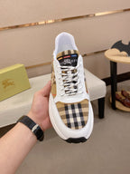 Burberry sneakers with white uppers, plaid toe panel, lace-up front, thick black sole