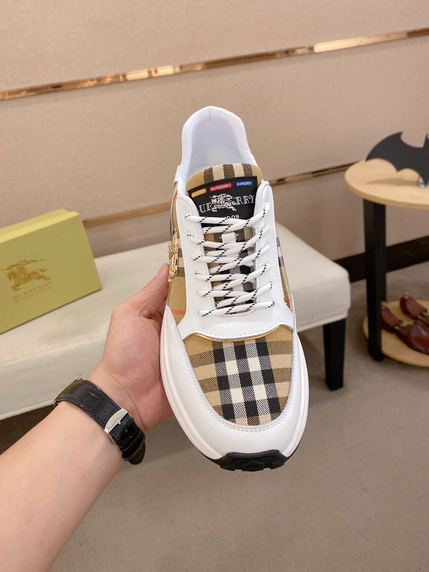 Burberry sneakers with white uppers, plaid toe panel, lace-up front, thick black sole