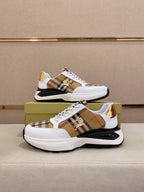 Burberry sneakers pair, white uppers with tan plaid panels and gold heel tabs