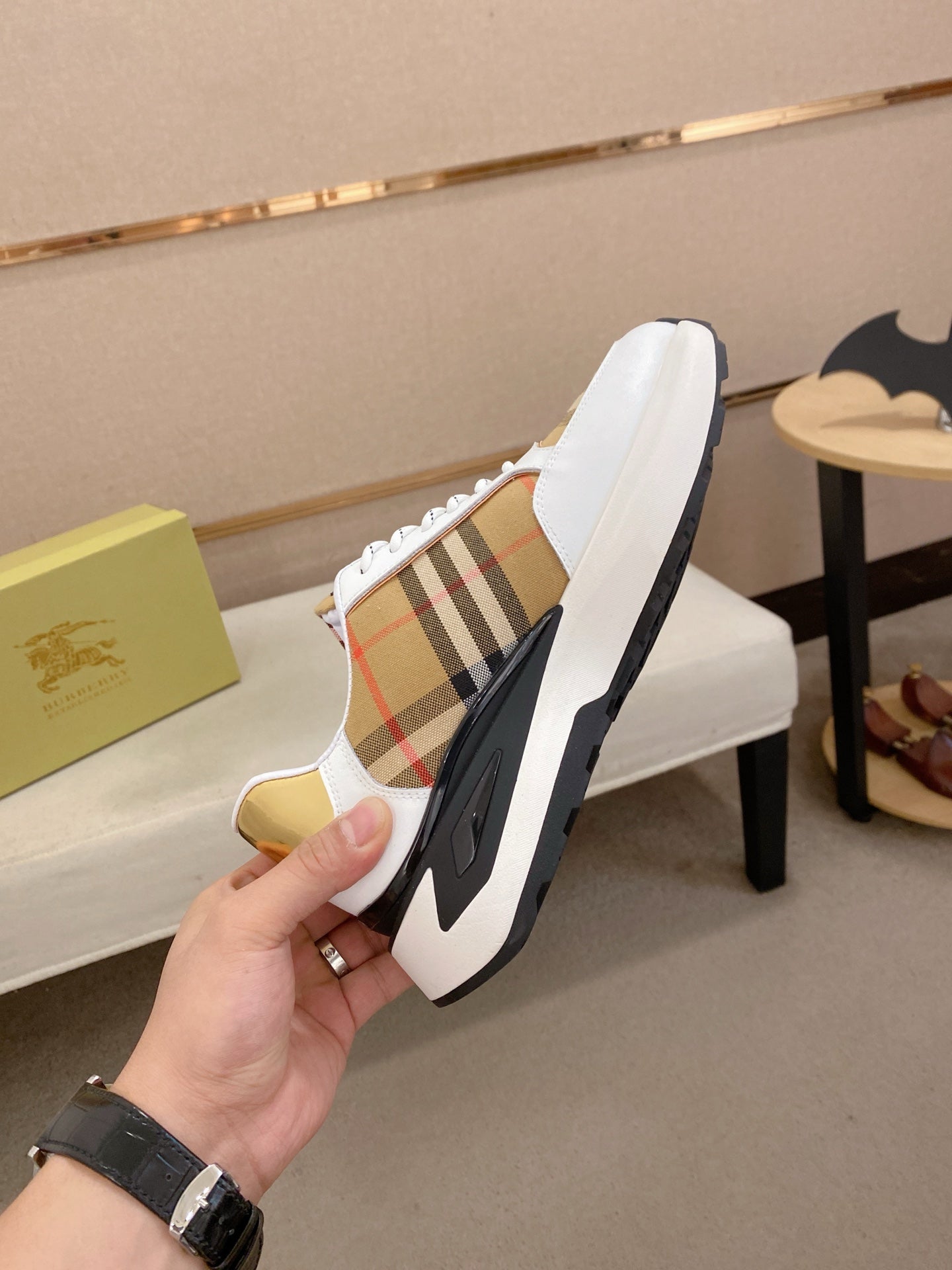 Burberry sneakers back view, white leather with plaid stripe, gold lining, chunky sole