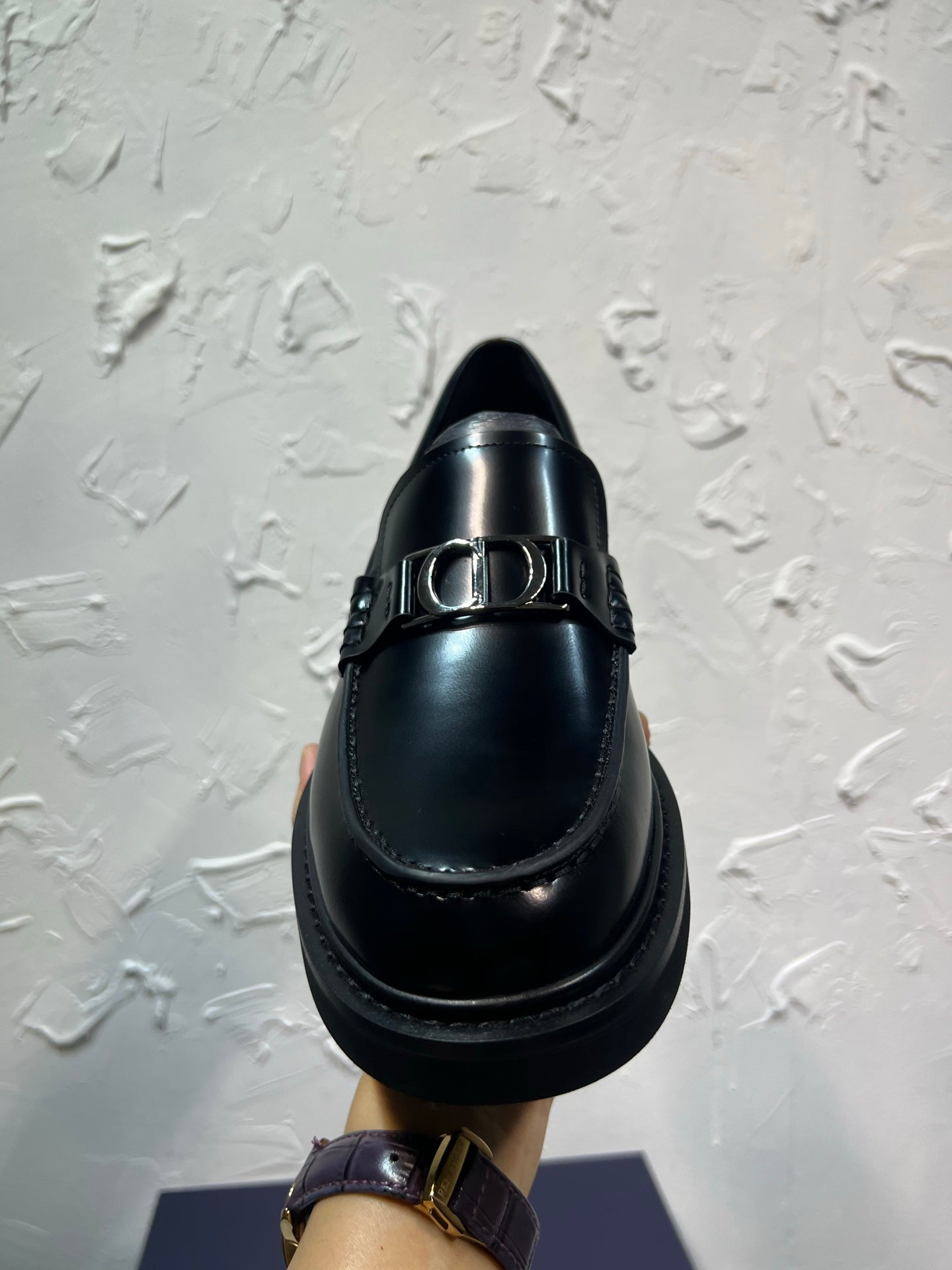 Black leather loafer with square buckle strap and smooth round toe