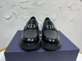 Black leather unisex loafers with square buckle detail and thick platform sole
