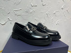 Black leather loafer with square metal buckle and stitched moc toe, platform sole