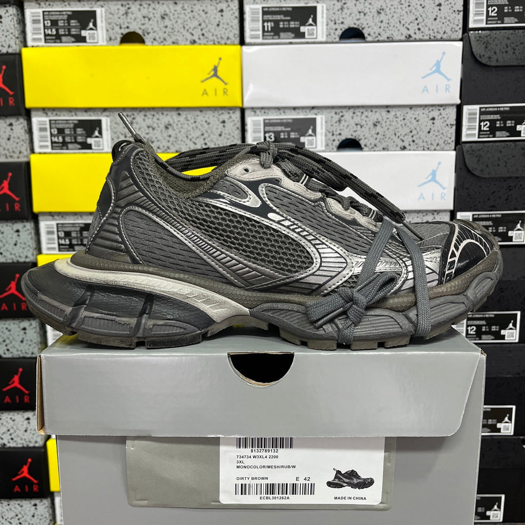 Balenciaga unisex athletic sneakers, side view of dark gray mesh upper with lace-up closure