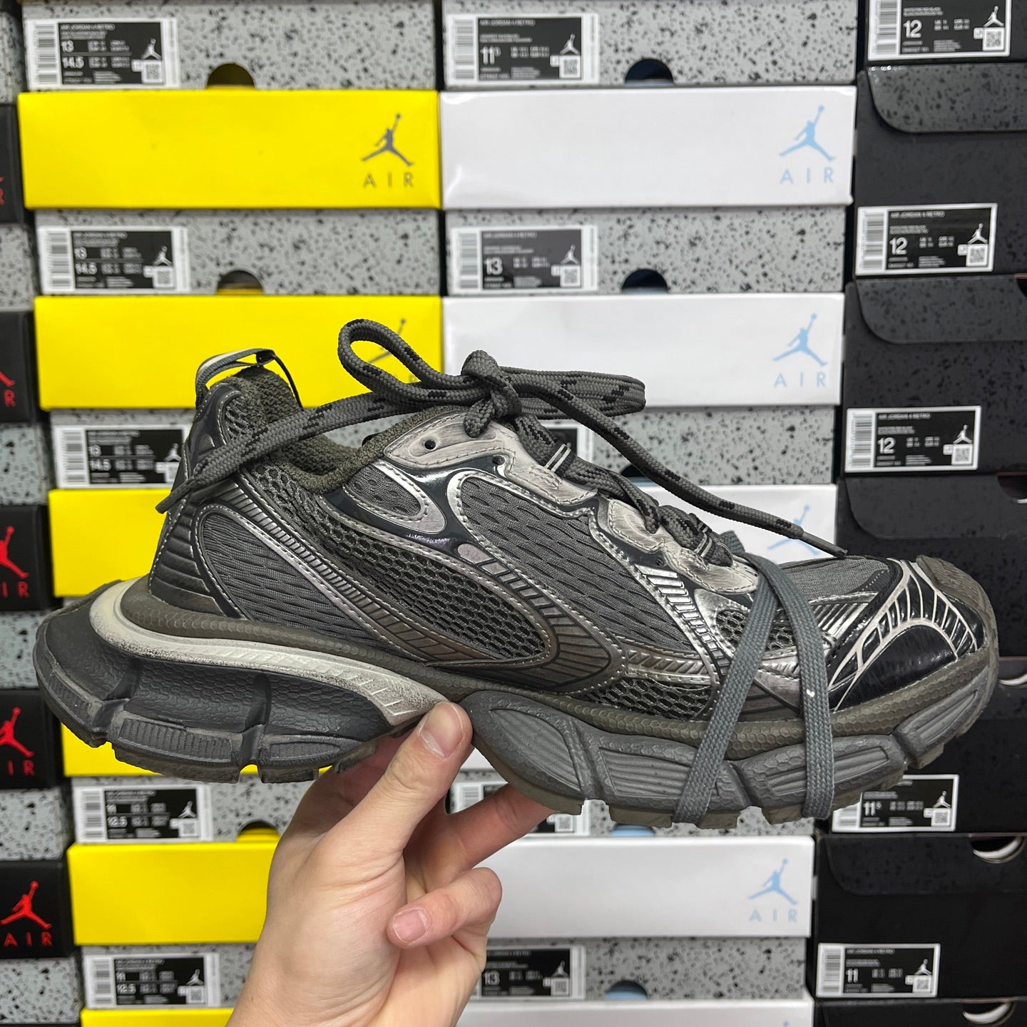Balenciaga unisex athletic sneakers, front side view in dark gray mesh with lace-up closure