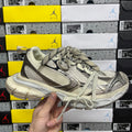 Balenciaga unisex sneaker, light gray mesh upper, black swoosh and lace-up design