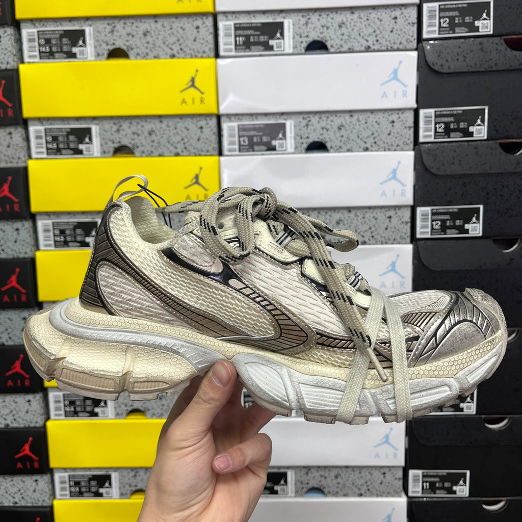Balenciaga unisex sneaker front side view, light gray mesh and black trim