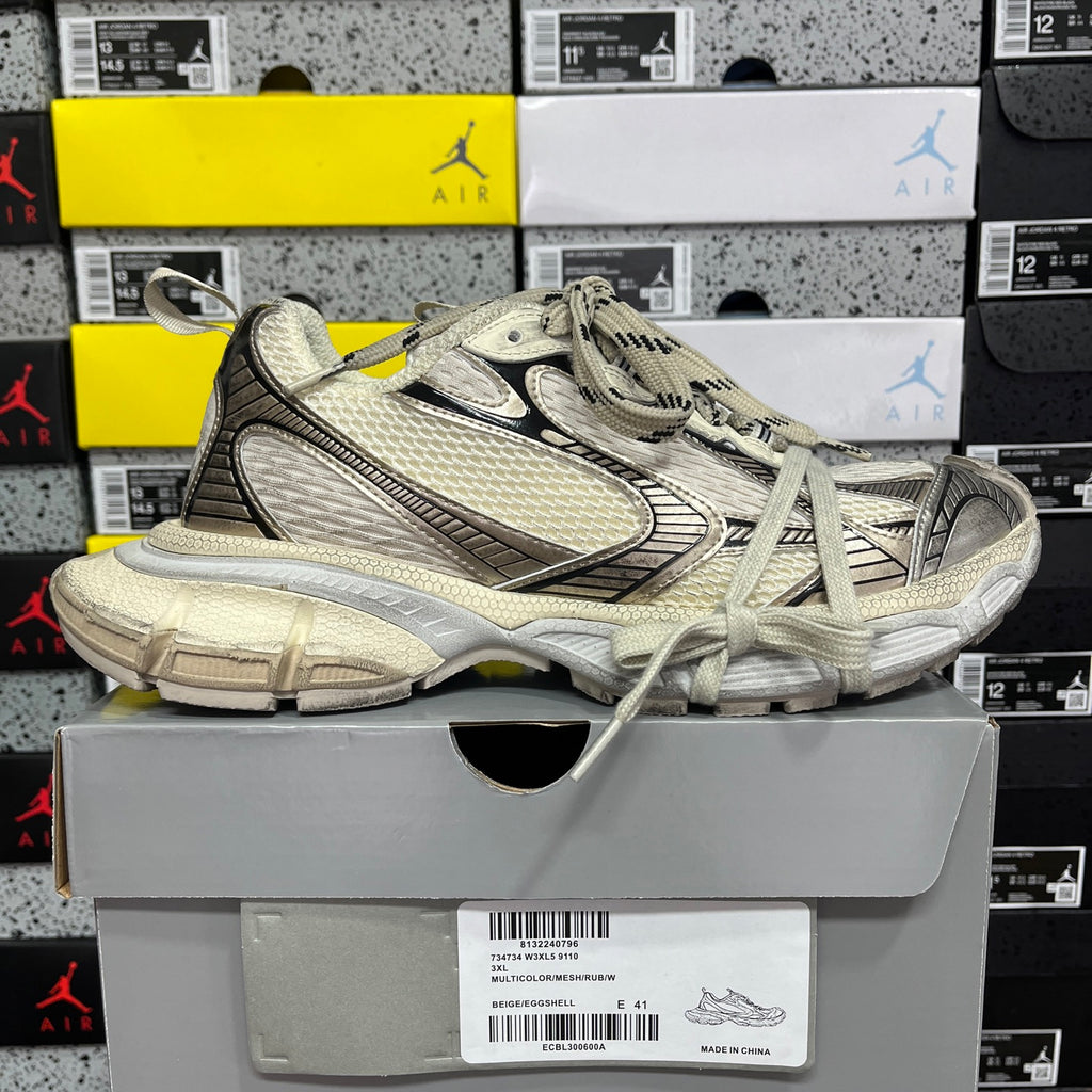 Balenciaga unisex sneaker side view, light gray mesh, chunky sole, lace-up