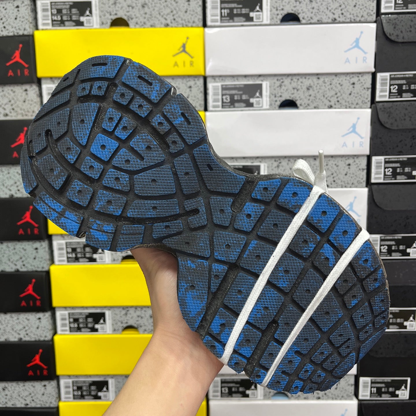 Balenciaga unisex sneakers outsole in dark gray with blue traction tread and white lace strap