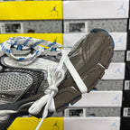 Balenciaga unisex sneakers side view with silver panels, textured toe, and white laces