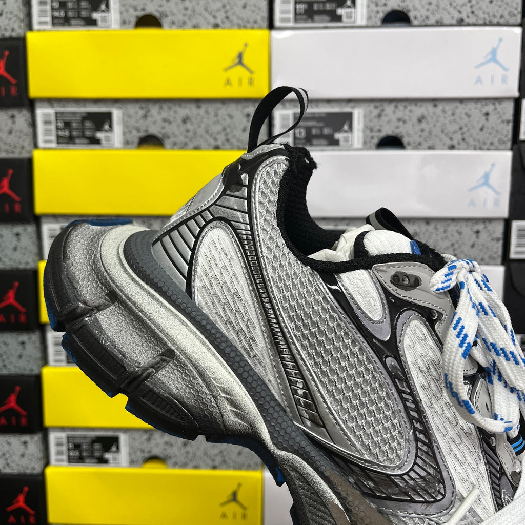 Balenciaga unisex sneakers side profile in silver with black collar and blue-and-white laces