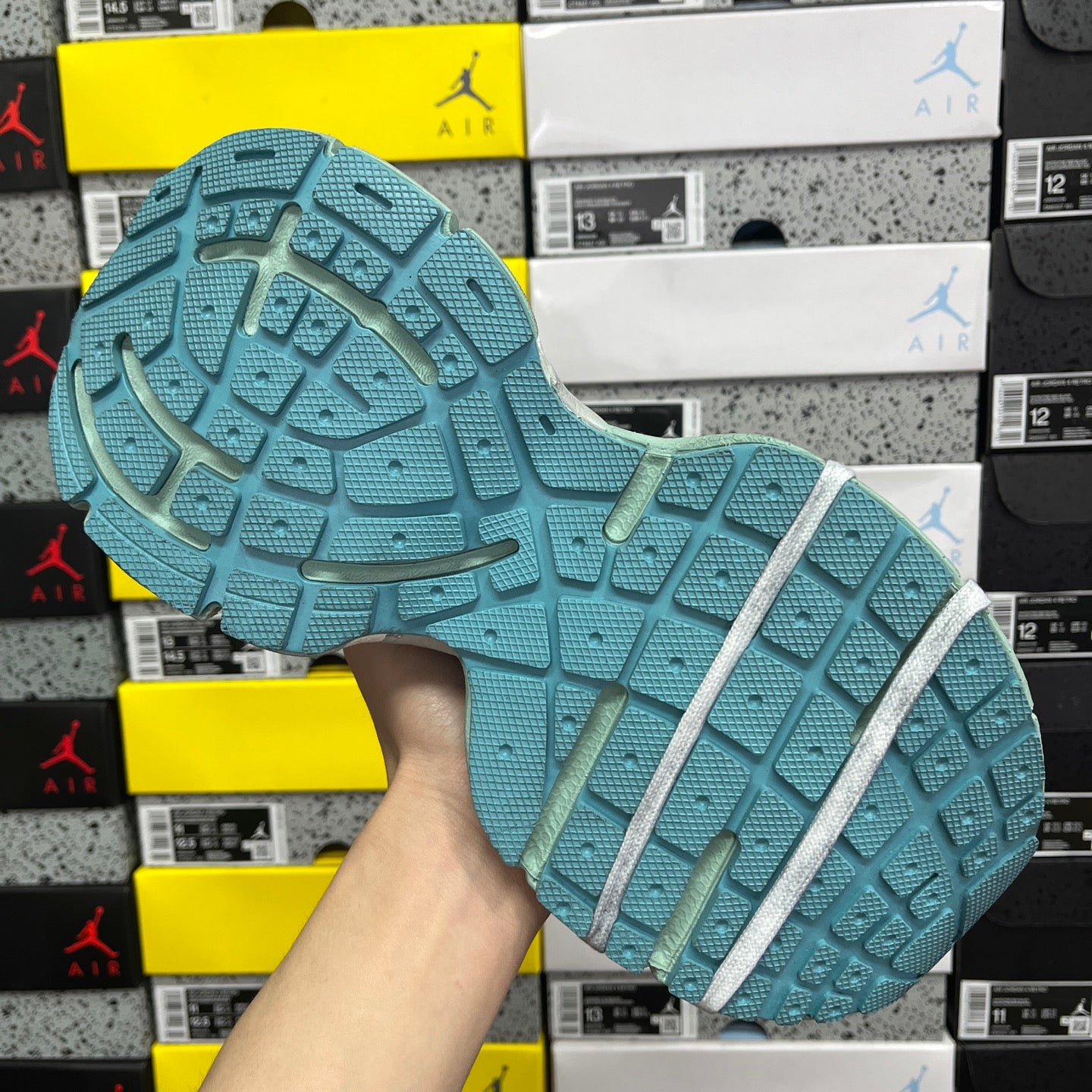 Balenciaga unisex sneaker outsole with teal traction tread and white side stripe