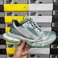 Balenciaga unisex sneaker in white, teal, and silver with blue lace trim and chunky sole