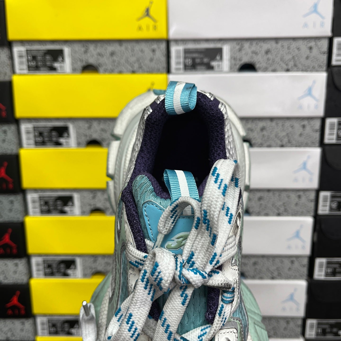 Balenciaga unisex sneaker interior view with dark navy lining and teal upper edge