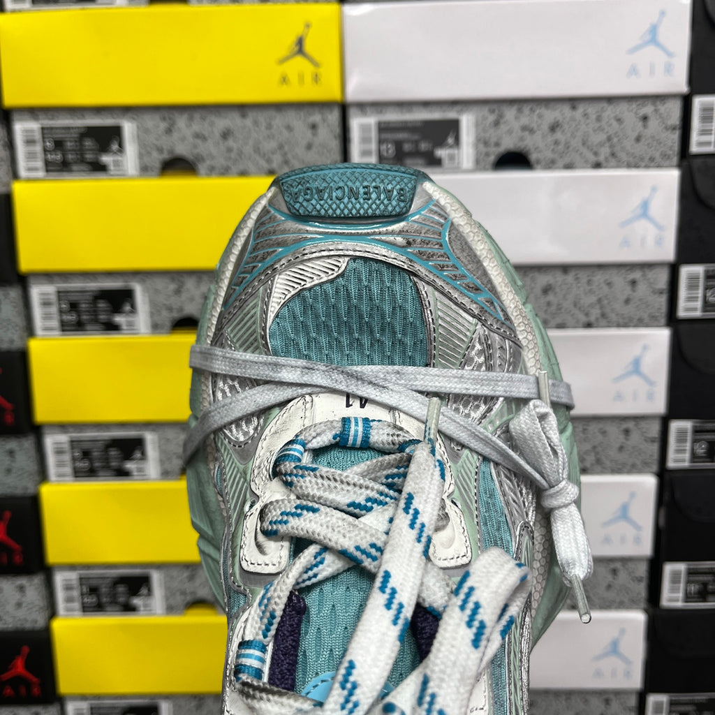 Balenciaga unisex sneaker close-up of laces and padded collar in teal and dark navy