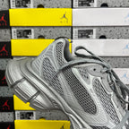 Gray mesh lace-up sneaker with side panel detailing and thick cushioned midsole
