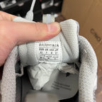 Light gray shoe interior with BALENCIAGA size label on tongue