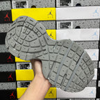 Gray mesh sneaker outsole with detailed tread pattern and cushioned side wall